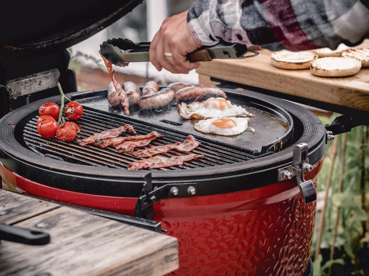 Cooking bacon, eggs, and tomatoes on a Kamado Joe